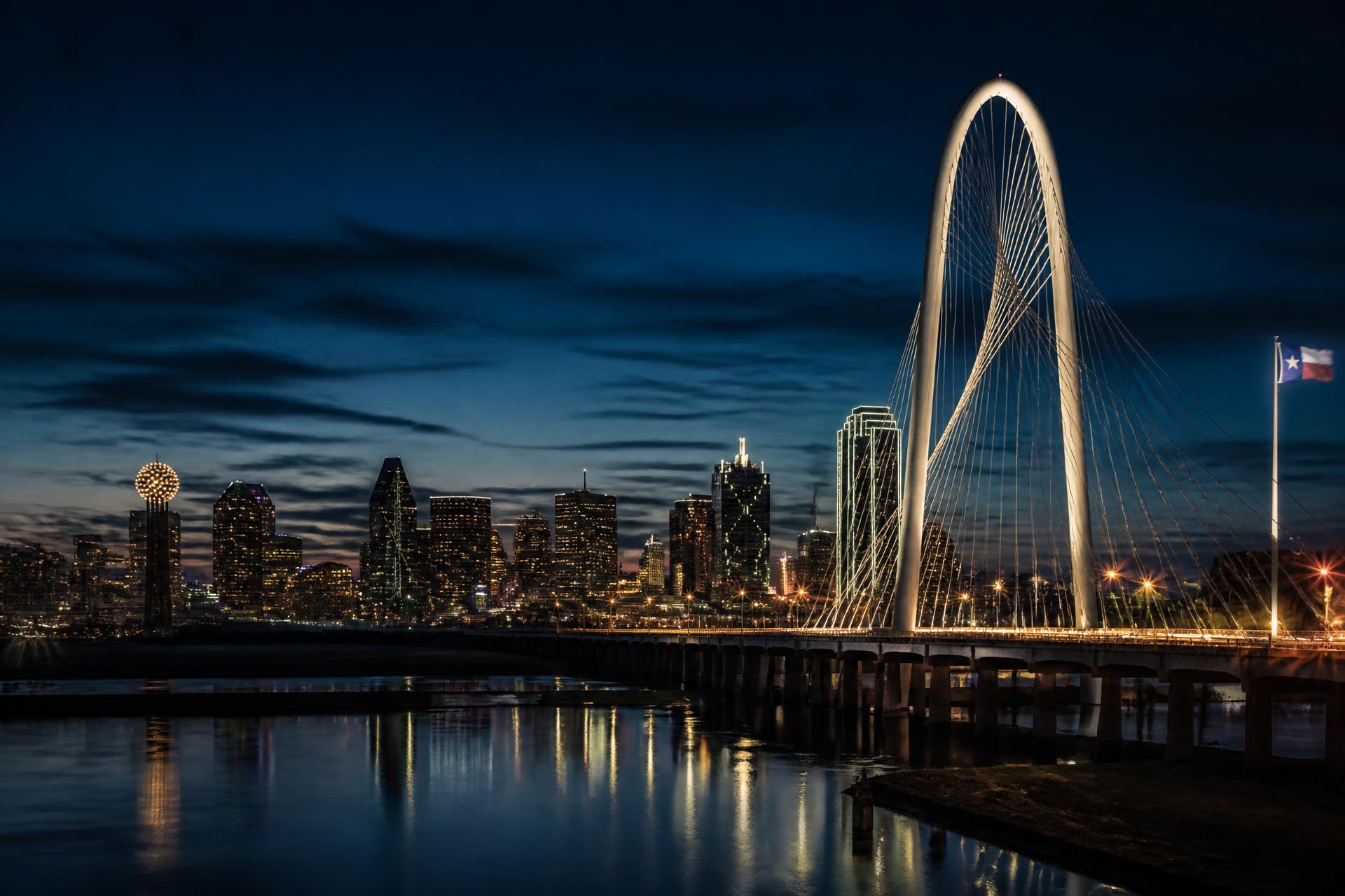 Dallas skyline at twilight with the Margaret Hunt Hill Bridge illuminated